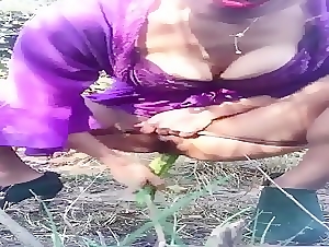 Cucumber used by a horny slut for masturbation