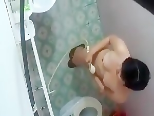 Asian babe spied while taking shower
