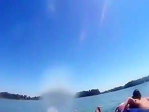 inner tube blowjob on public lake
