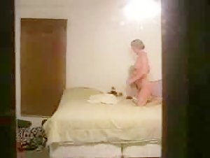 Spying on a girl masturbating with a dildo