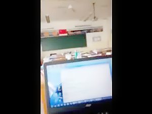 The slut sucks dick in the classroom